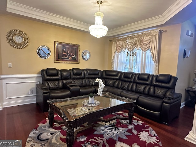 living room featuring ornamental molding, wainscoting, a decorative wall, and wood finished floors