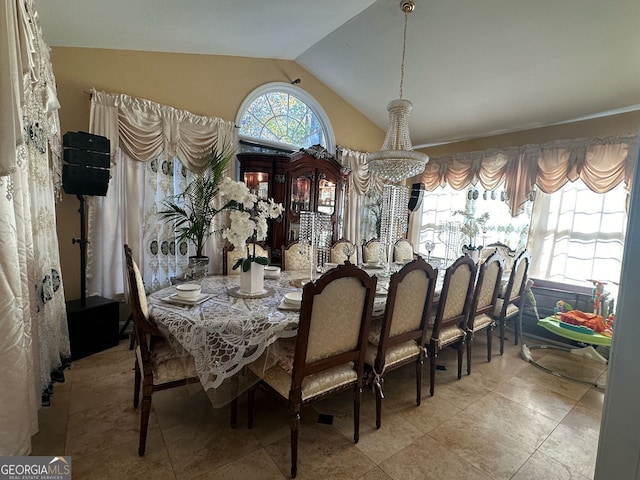 dining space featuring lofted ceiling