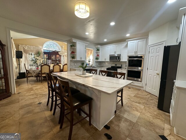 dining room featuring lofted ceiling