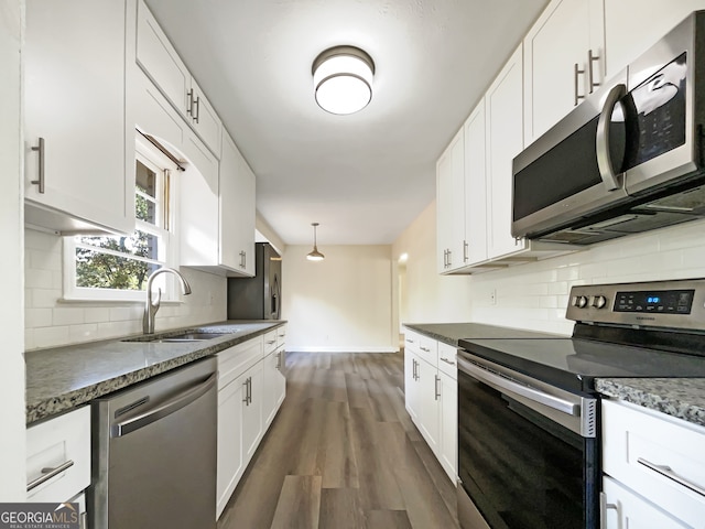 kitchen with white cabinetry, sink, dark hardwood / wood-style floors, and stainless steel appliances