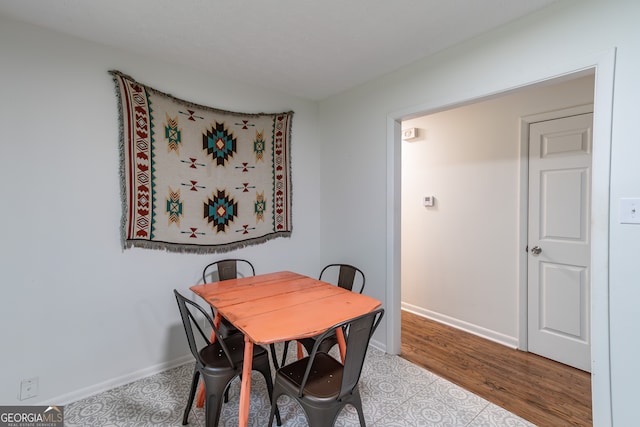 dining room with wood-type flooring