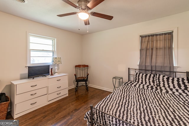 bedroom featuring dark hardwood / wood-style floors and ceiling fan