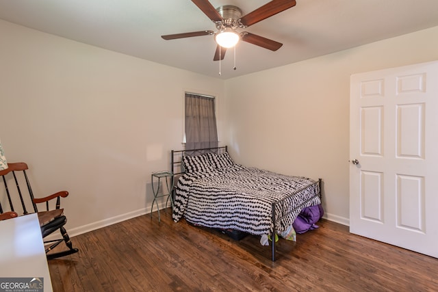 bedroom with dark wood-type flooring and ceiling fan