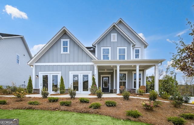 view of front of house with french doors and covered porch