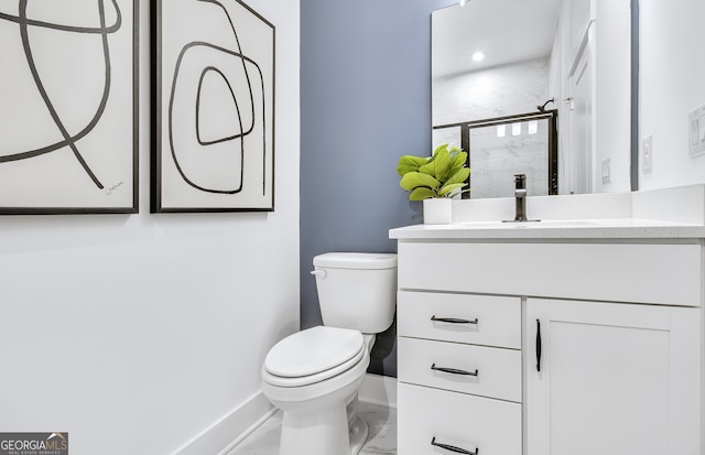 bathroom featuring walk in shower, vanity, and toilet