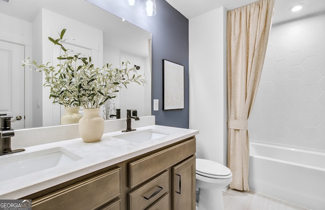 full bathroom featuring vanity, shower / bath combination with curtain, and toilet