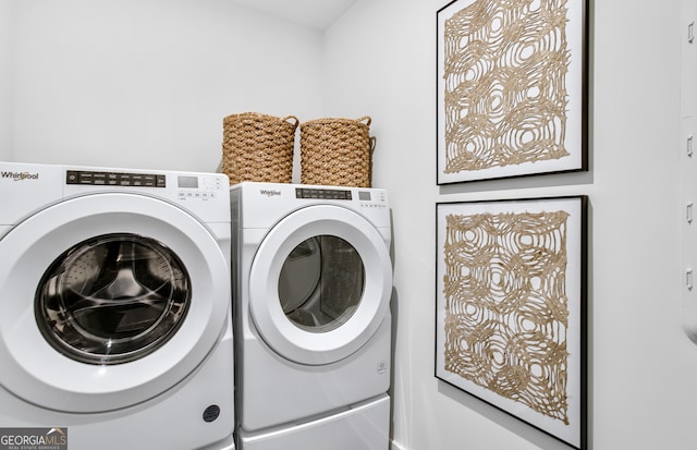 laundry room with washing machine and clothes dryer