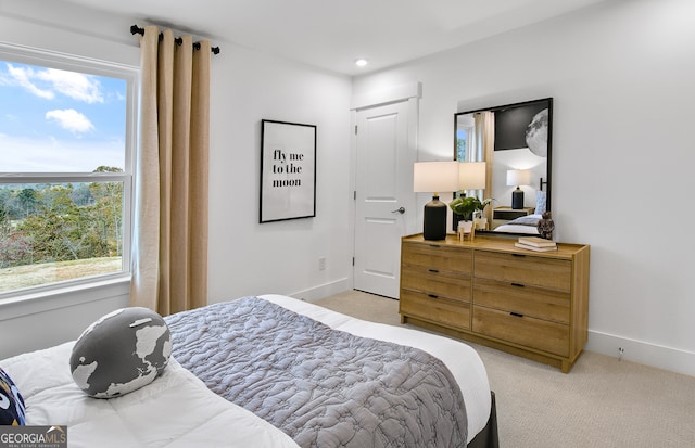 bedroom with light colored carpet