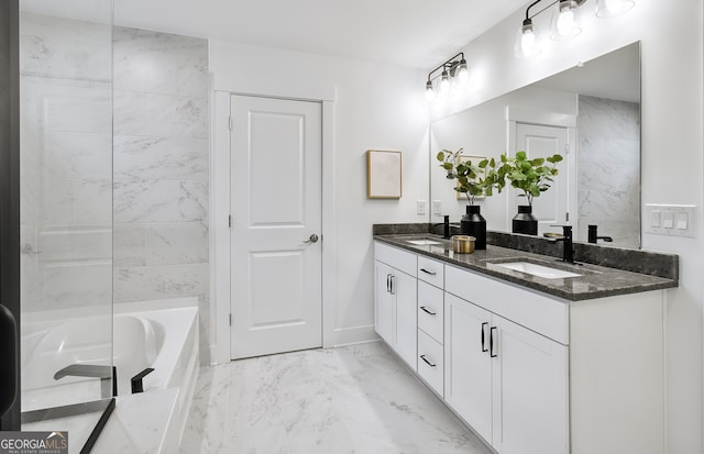 bathroom featuring a tub and vanity