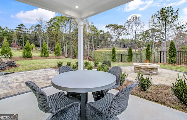 view of patio / terrace featuring an outdoor fire pit