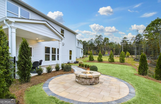 view of patio with a fire pit