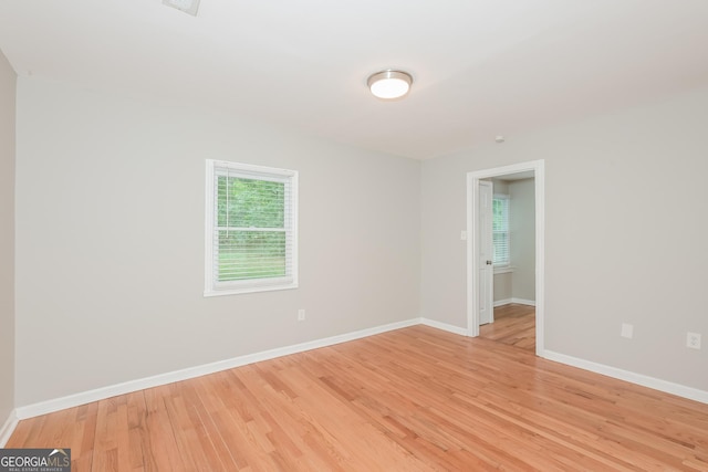 unfurnished room with light hardwood / wood-style flooring