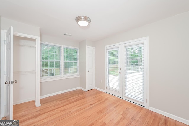 interior space featuring light hardwood / wood-style flooring and french doors