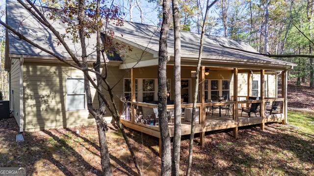 back of house with a deck