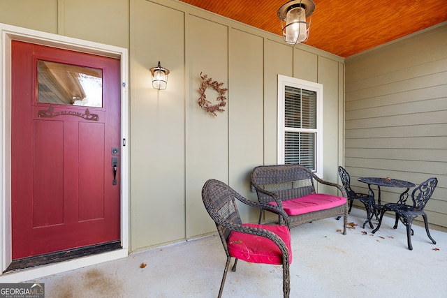 view of exterior entry with a porch