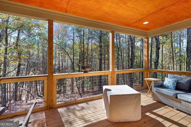 sunroom / solarium featuring wood ceiling