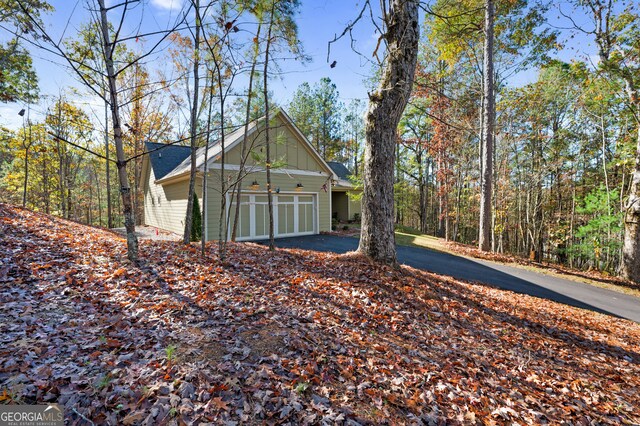 view of side of property featuring a garage