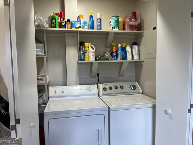 clothes washing area with separate washer and dryer