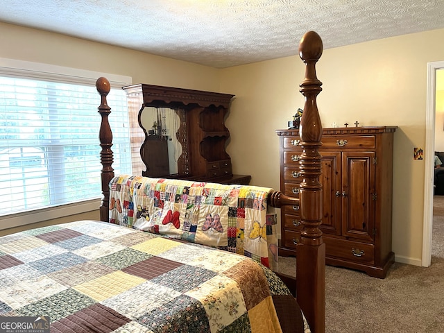 carpeted bedroom with a textured ceiling