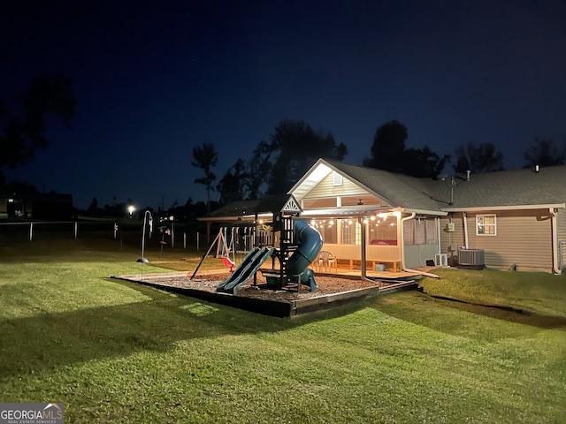 playground at night with a yard