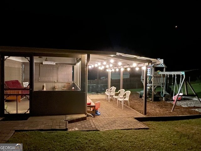 exterior space featuring a playground and a yard