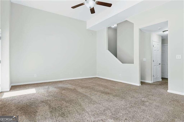 carpeted empty room with ceiling fan