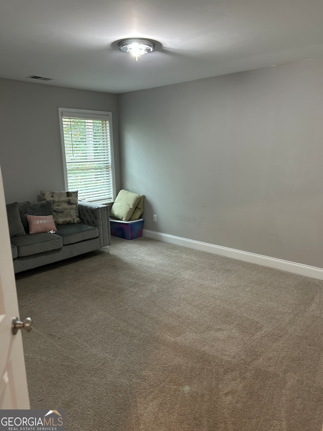 sitting room with carpet flooring