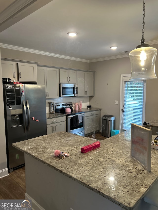 kitchen with appliances with stainless steel finishes, dark hardwood / wood-style floors, light stone counters, and gray cabinetry