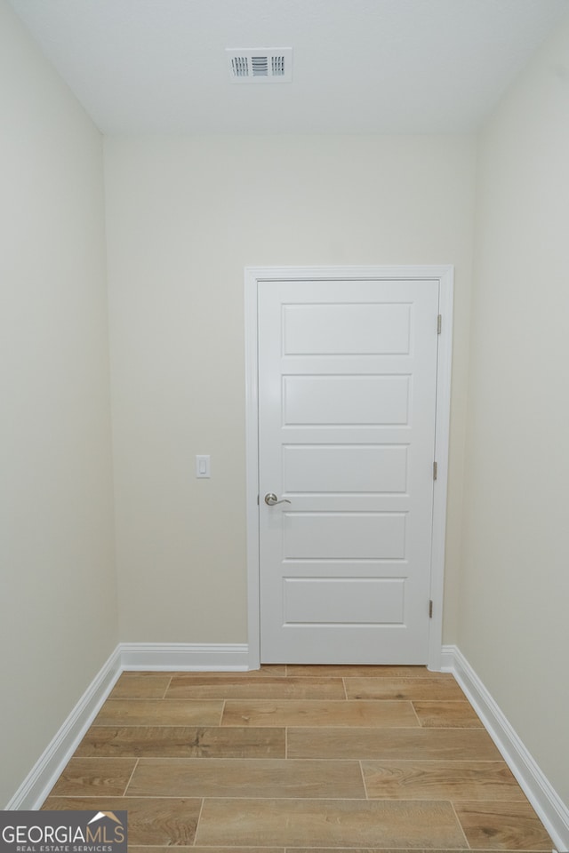 spare room featuring hardwood / wood-style floors