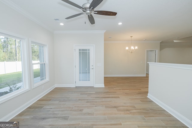 unfurnished room with ornamental molding, light wood-type flooring, and ceiling fan with notable chandelier