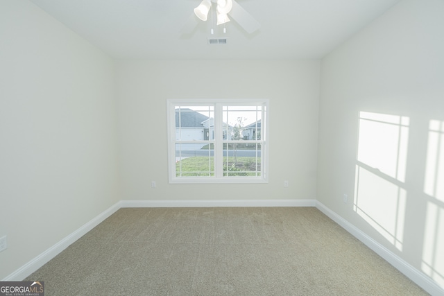 carpeted empty room with ceiling fan