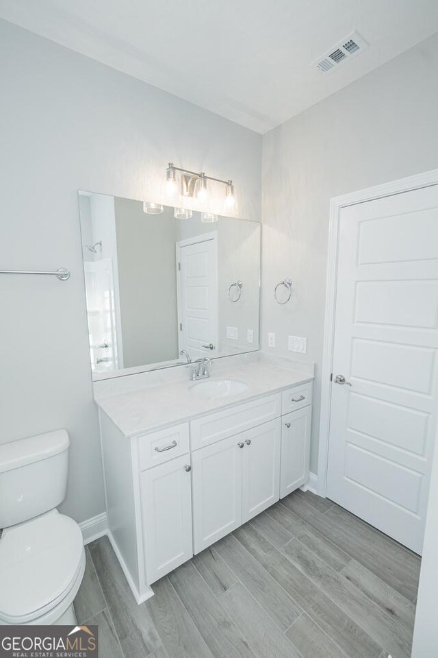 184 The Villas Way, Kingsland, GA 31548 - bathroom with wood-type flooring, vanity, and toilet