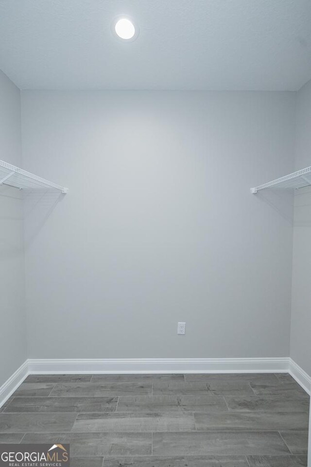184 The Villas Way, Kingsland, GA 31548 - spacious closet featuring hardwood / wood-style floors