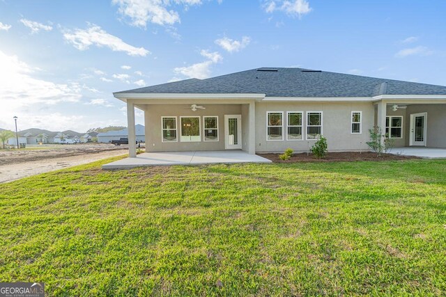 184 The Villas Way, Kingsland, GA 31548 - rear view of house with ceiling fan, a patio, and a yard