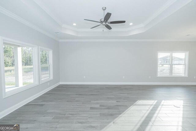 184 The Villas Way, Kingsland, GA 31548 - unfurnished room with light hardwood / wood-style floors, ceiling fan, a raised ceiling, and ornamental molding