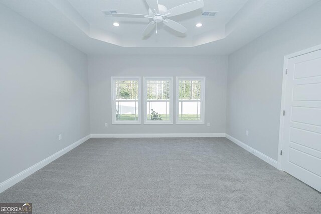 184 The Villas Way, Kingsland, GA 31548 - empty room featuring a tray ceiling, ceiling fan, and carpet floors