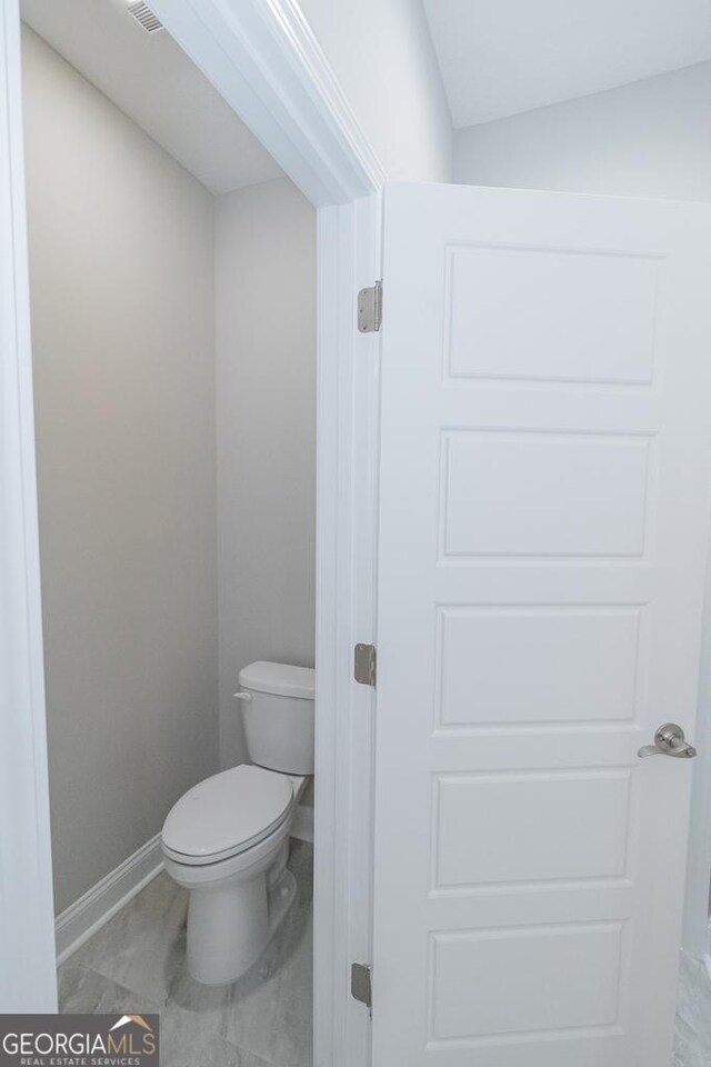 184 The Villas Way, Kingsland, GA 31548 - bathroom featuring lofted ceiling and toilet
