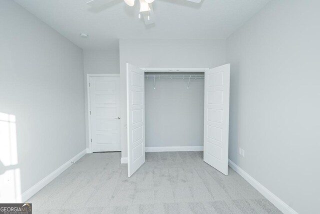184 The Villas Way, Kingsland, GA 31548 - unfurnished bedroom with ceiling fan, light carpet, and a closet