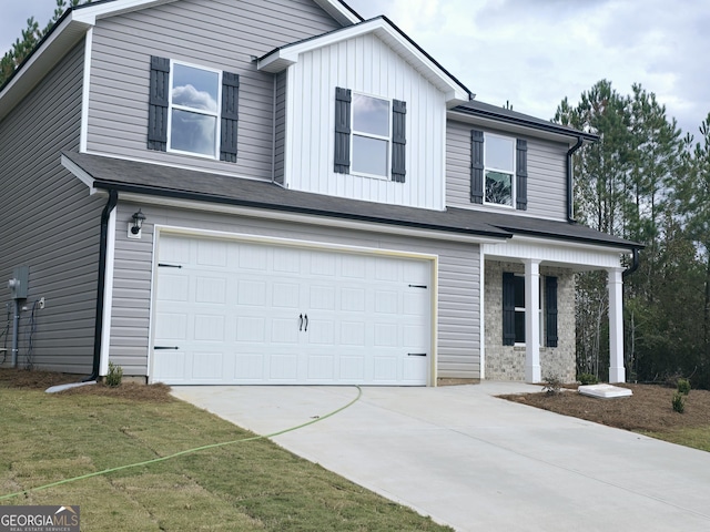 view of front facade with a front yard and a garage