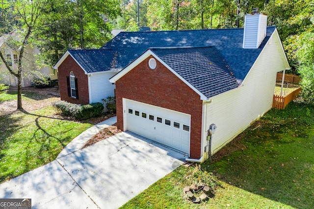 view of front of house with a garage and a front yard