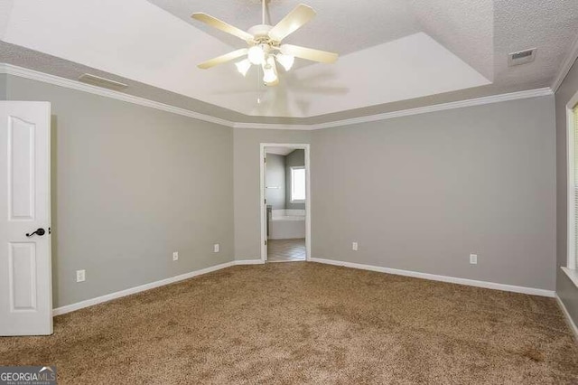 unfurnished room featuring ceiling fan, a textured ceiling, carpet flooring, and crown molding