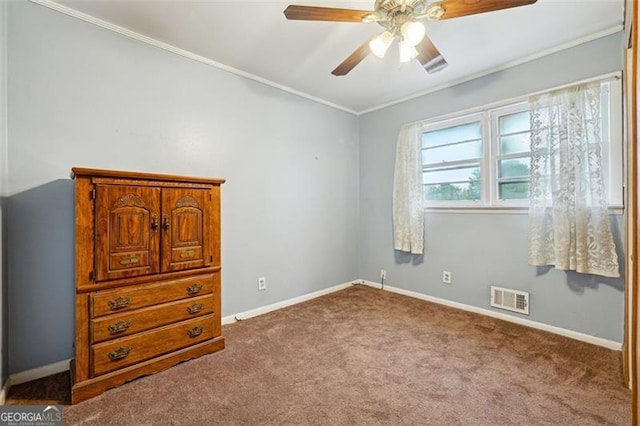 bedroom with carpet flooring, ornamental molding, and ceiling fan