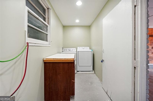 laundry area with washing machine and clothes dryer