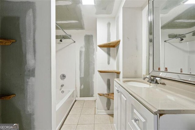 bathroom featuring bathtub / shower combination, vanity, and tile patterned floors