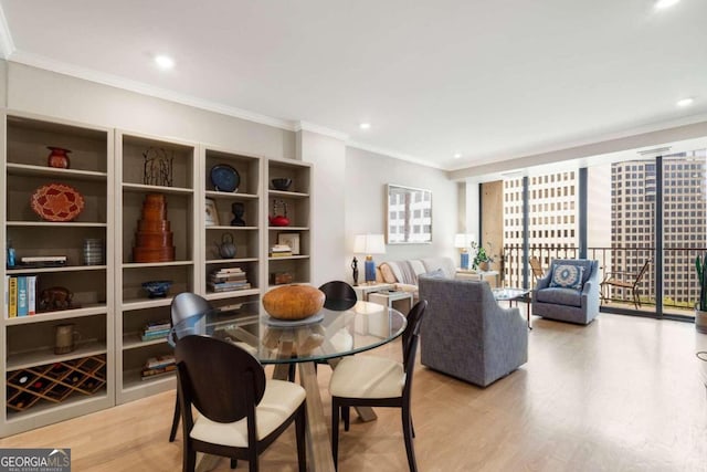 dining area featuring floor to ceiling windows, light hardwood / wood-style flooring, and crown molding