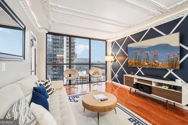 living room featuring wood-type flooring and floor to ceiling windows