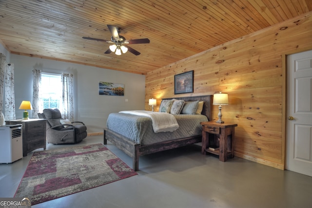 bedroom featuring wooden walls, ceiling fan, wood ceiling, and concrete floors