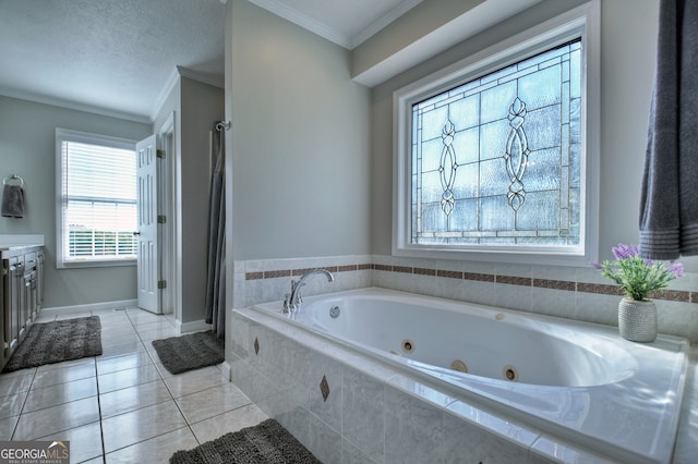 bathroom featuring tile patterned floors, a textured ceiling, tiled tub, vanity, and crown molding