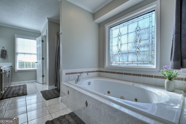 full bath featuring a textured ceiling, vanity, a jetted tub, tile patterned floors, and crown molding