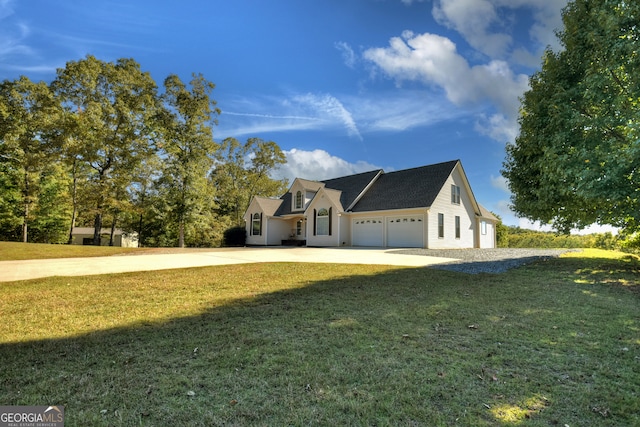 view of front facade with a garage and a front yard